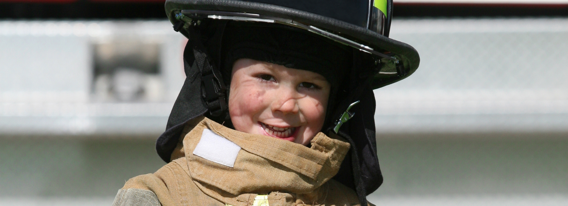 child in a firefighter uniform