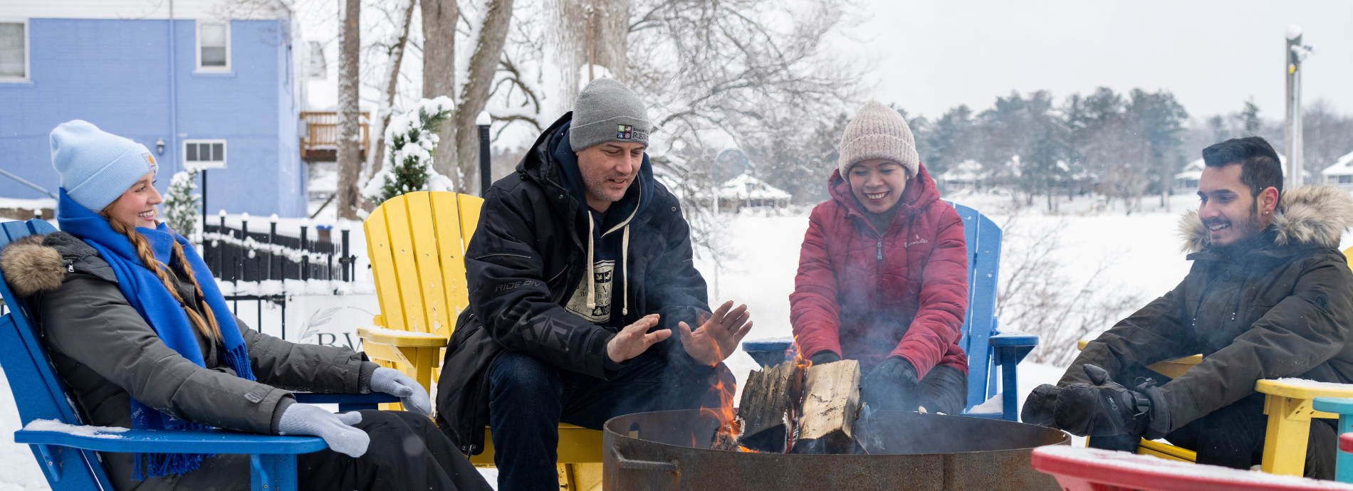 people gathered around an outdoor fire