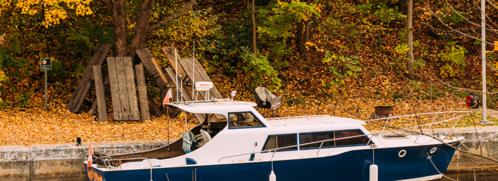 boat by a dock in fall