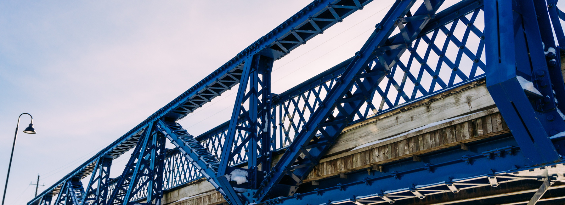 blue bridge covered in ice and snow